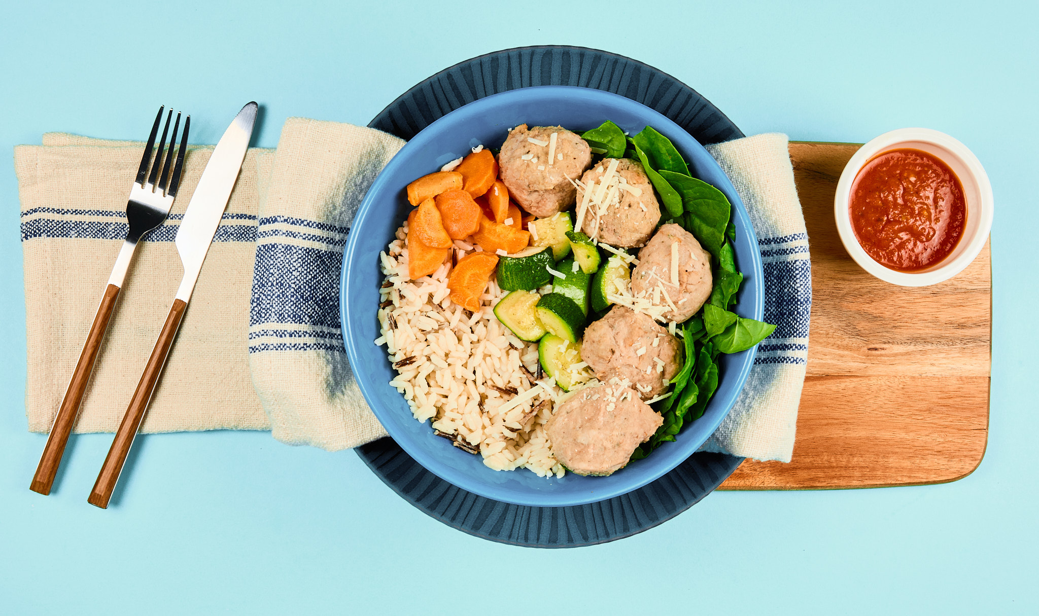 Walnut Bean Balls with Puttanesca Sauce On Wild Rice